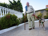 An old man walks to Miko in the gardens of the San Cipriano Residence in Soto de la Marina, Cantabria, Spain, on 16 January  in one of the t...