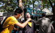 ISTANBUL, TURKEY--A man is given vinegar as treatment for tear gas. Protesters fought agai...