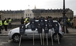 a group of people standing in front of a building  during an anti-government demonstration...