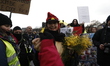 a group of people holding a sign  during an anti-government demonstration called by the Ye...