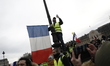 a group of people standing in front of a crowd  during an anti-government demonstration ca...