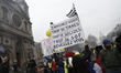 a group of people standing in front of a crowd  during an anti-government demonstration ca...