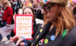 Women gather on Portland Place the anti-austerity 'Women's March for Bread and Roses' in L...