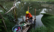 Citizens use dirty river water for their daily needs at Cikarang regency, West Java on Sat...