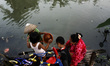 Citizens use dirty river water for their daily needs at Cikarang regency, West Java on Sat...