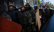 Anti-government opposition activists march around the "government quarter", including the...