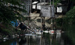 Citizen defecates on the river at Cikarang regency, West Java on Saturday, January 19, 201...