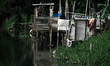 Wooden toilet built by residents to defecate lined up on the river at Cikarang regency, We...