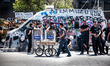 ISTANBUL, TURKEY--A simit seller passes by a police line in Taksim Square near Gezi Park....