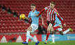 . Manchester City's Taylor Harwood-Bellis in action with Sunderland's Duncan Watmore durin...
