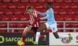 . Duncan Watmore of Sunderland battles with Manchester City's Nathaniel Ogbeta during the...