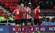 . Sunderland's Dylan McGeouch, Benji Kimpioka and Bryan Oviedo congratulate Duncan Watmore...