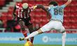 . Benji Kimpioka of Sunderland battles with Manchester City's  Colin Rsler during the Chec...