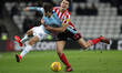 . Luke O'Nien of Sunderland battles with Iker Pozo of Manchester City  during the Checkatr...