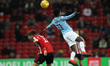 Jeremie Frimpong of Manchester City and\ Lynden Gooch in action during the Checkatrade Tro...