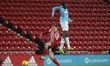 Nathaniel Ogbeta of Manchester City and Duncan Watmore in action during the Checkatrade Tr...