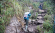 Porters carrying parts for the new cable car. Fansipan mountain in Vietnam with the highes...