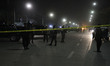 Afghan security forces walk in front of the main gate of the French Cultural Centre locate...