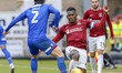  Northampton Town's captain Aaron Pierre is challenged by Morecambe's Zak Mills during the...