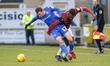 . Morecambe's Liam Mandeville is challenged by Northampton Town's captain Aaron Pierre dur...