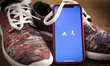 The Adidas running application is seen on an iPhone in this photo illustration on January...