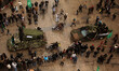 Palestinian members of al-Qassam Brigades, the armed wing of the Hamas movement, display w...