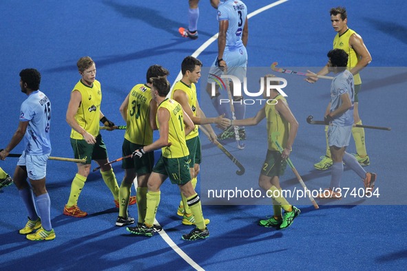 (141214) -- BHUBANESWAR, Dec. 14, 2014 () -- Australian hockey players celebrate their goal during the bronze medal match between India and...
