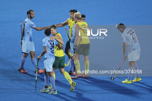 (141214) -- BHUBANESWAR, Dec. 14, 2014 () -- Players of Australia and India greet each other after the bronze medal match between India and...