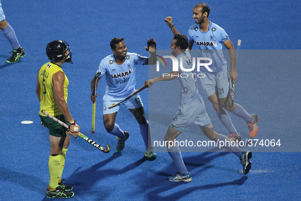 (141214) -- BHUBANESWAR, Dec. 14, 2014 () -- Indian hockey players celebrate their goal during the bronze medal match between India and Aust...