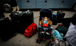 A Palestinian Child waits with his family, hoping to cross into Egypt, at Rafah crossing b...
