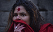 A Portrait of Nepalese Hindu girl during ritual holy Bath at Pashupathnath Temple, Kathman...