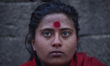 A Portrait of Nepalese Hindu girl during ritual holy Bath at Pashupathnath Temple, Kathman...