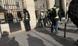 Men wearing a yellow vest demonstrate in front of the French Senate, rue de Rivoli, during...