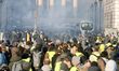 French yellow vests (Gilets jaunes) protesters clash with French riot police on the Concor...