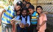 A Bangladeshi Photographer taking Selfi with Rohingya children in the Balukhali refugee ca...