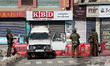 Indian paramilitary soldiers stand near a temporary check point in Srinagar,Kashmir on the...