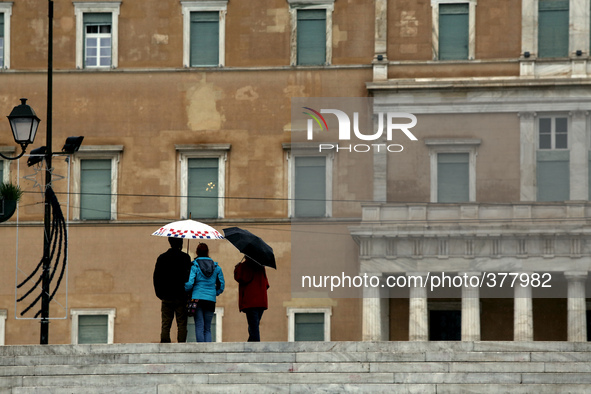 Tourists in front of the building of the Greek parliament the day of the first of three, presidential ballots in Athens on Wednesday Decembe...