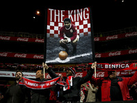 Benfica supporter holds a poster in tribute to ex-Benfica player Eusébio during the Portuguese Cup football match between SL Benfica and SC...