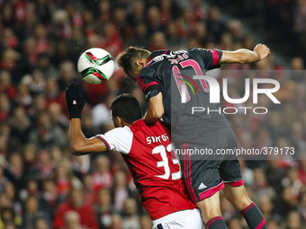 Benfica's forward Jonas  (R) scores his team's first goal  during the Portuguese Cup football match between SL Benfica and SC Braga at Luz...