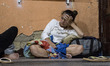 Venezuelans rest after several hours of walking in a refuge of the Samaritans Purse Founda...