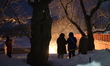 Festival goers watch the fire dance performance during the Hiburi Kamakura Festival in Kak...