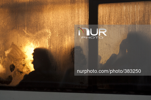 Passengers in a bus window on a cold day in St. Petersburg, Russia 29 december 2014. Temperatures in St Petersburg fall to minus 17 degree C...