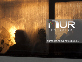 Passengers in a bus window on a cold day in St. Petersburg, Russia 29 december 2014. Temperatures in St Petersburg fall to minus 17 degree C...