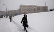 A woman wades through the snow near the metro station Derzhprom, in Kharkov, Ukraine, on D...