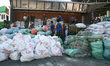 US Marines and Philippine Air Force soldiers unload a truck full of relief goods from the...