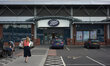 A person approaching Boots, the UK pharmacy and beauty chain, in central Stockport. 