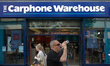 People outside The Carphone Warehouse in central Manchester as an older male takes a drink...