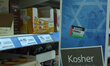 A 'Boycott Israeli Aparthied' sticker on a sign, in a Tesco store, for Kosher. 