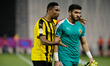 Qatar SC forward, Samuel Eto’o, gives some advice to his goalkeeper teammate, Jassem Adel,...