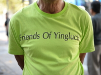 A supporter of former Thai Prime Minister, Yingluck Shinawatra wears a shirt reads 'friend of Yingluck' outside the Parliament in Bangkok, T...